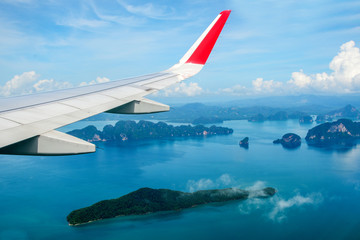 Tropical group of islands in Thailand as seen on window through window of an aicraft. Top view