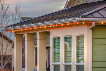 Fototapeta na wymiar Christmas lights framing the roof of home in Utah