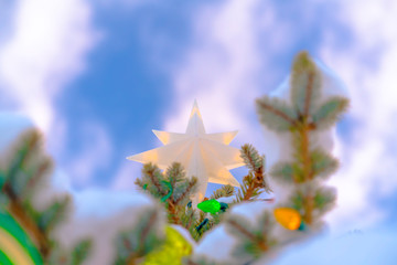 Close up of a decorated tree against cloudy sky