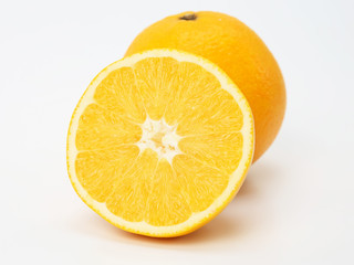 Cut citrus fruit of orange on white background