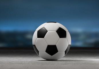 Fototapeta na wymiar Football ball on the field of a city stadium - 3d rendering