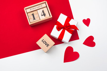 Valentines day greeting card. gift box on red table. Top view with copy space