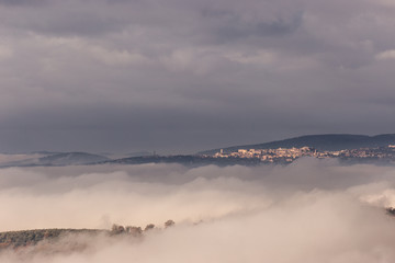 A view of Perugia city (Umbria, Italy) above a sea of fog