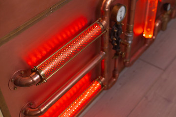 Copper tubes with liquid and red lighting