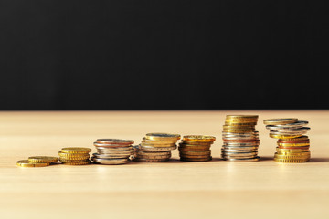 piles of coins on working table