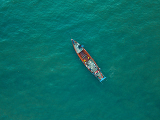 Fototapeta premium Vintage wooden boat in coral sea. Boat drone photo.