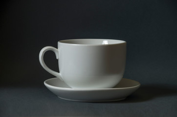 A cup and saucer of white color for tea.