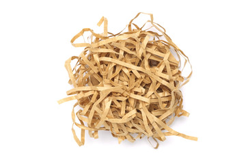 Pile of shredded paper brown color on white background, Like a bird nest.