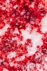 Red blood on white snow as a background