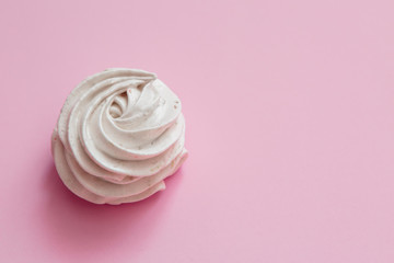 handmade marshmallows in pink and white are lying on the table in close-up. place for text, postcard