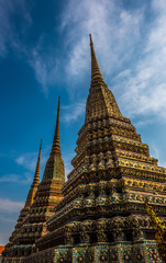 Fototapeta premium Grand Palace Bangkok Decorative Pagodas against blue sky