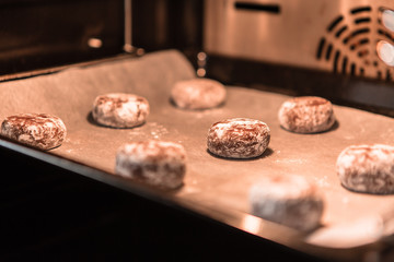 freshly baked chocolate cookies sprinkled with powdered sugar close-up