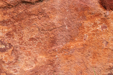 Red stone in nature as background