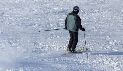 Man skiing in the snow in winter