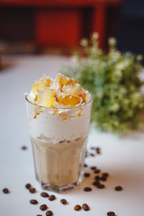 Cappuccino with cream and tangerine slices