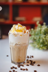 Cappuccino with cream and tangerine slices