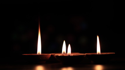 Four candles or butter lamps
