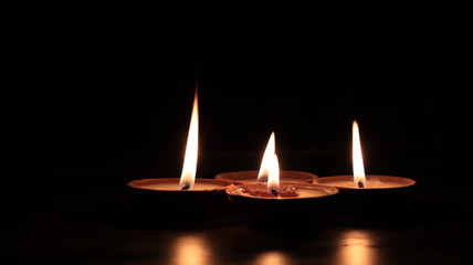 Four candles or butter lamps
