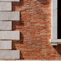 Part of the facade of the red brick wall.