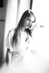 Cute brunette girl posing for photo in home studio