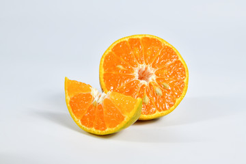 Fototapeta na wymiar Half and slice of orange on white background.