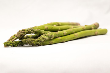 Close up of organic asparagus isolated on a white background
