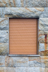 Old stone masonry wall covered with moss mountain gray.