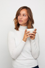 portrait of young woman with cup of coffee