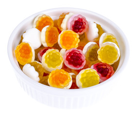 Sweet colored jelly candies on white plate