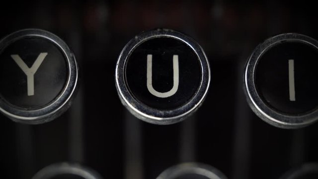 Macro close up of the U key on an old Remington Rand Model 1 Typewriter.