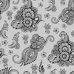 Indian floral ornament on a gray background. Seamless pattern in mehndi style.