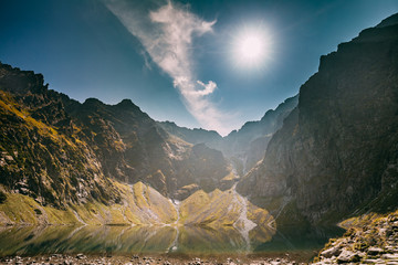 Tatra National Park, Poland. Calm Lake Czarny Staw Under Rysy And Summer Mountains Landscape....