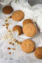 Oatmeal cookies handmade, Oatmeal Flakes, Raisins on a light background. Breakfast Concept