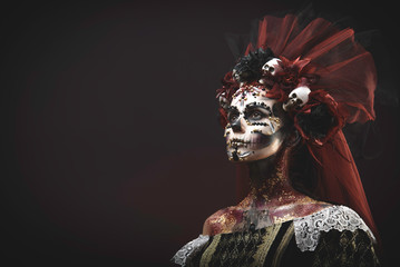 Young girl in the image of Santa Muerte