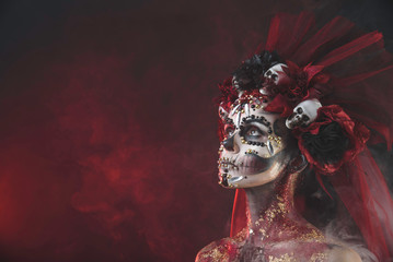Young girl in the image of Santa Muerte