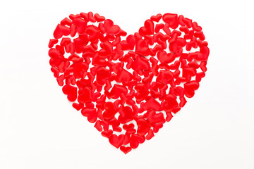 Obraz na płótnie Canvas Valentines day background red hearts on white wooden background.
