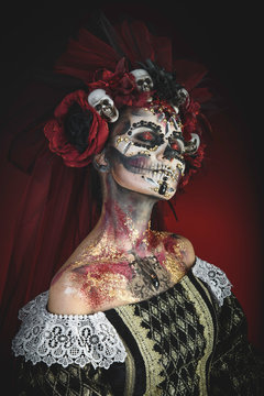 Young girl in the image of Santa Muerte