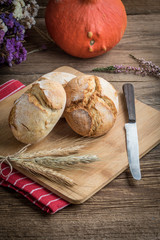 Roll breads on cutting board.