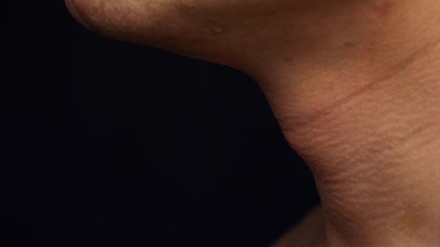 man gulp Adam's apple close up sequence