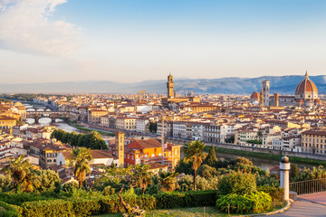Fototapeta na wymiar Florence Italy. Skyline cityscape of Firenze with Florence Duomo, Basilica di Santa Maria del Fiore and bridge Ponte Vecchio over the river Arno.