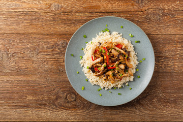 Pork chop with peppers, mushrooms and bamboo. Served with rice.