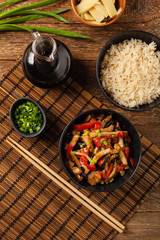 Pork chop with peppers, mushrooms and bamboo. Served with rice.