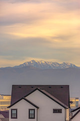 Home in Daybreak against Wasatch mountain and sky