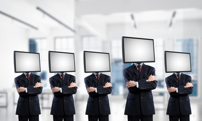 Businessmen with TV instead of head.