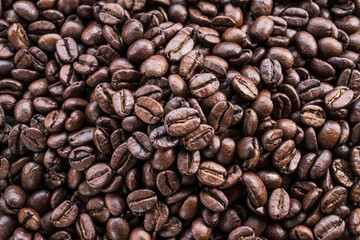 Roasted coffee beans. Food and drink background. Top view.