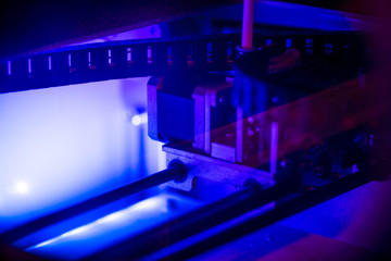 Working with 3D printer in the laboratory and studying technology. Printer is heating up. Macro...