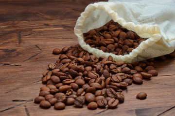 coffee beans on a wooden background scattered