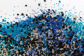 Layered colorful sand pattern. Marble style background. Blue and gold powder texture.