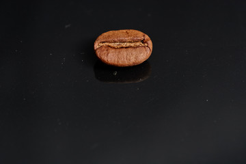 coffee beans on black background consistent with
