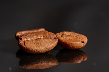 coffee beans on black background consistent with